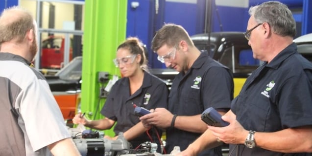 picture of students in automotive repair class