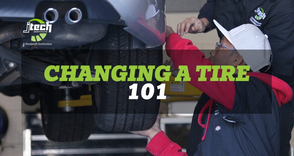 worker changing a tire