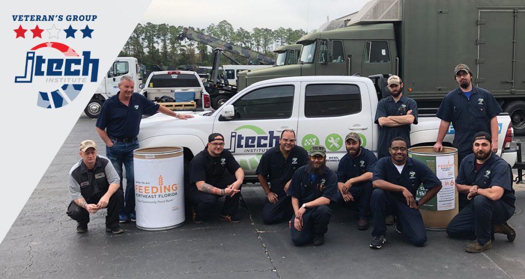 jtech students hanging by a truck