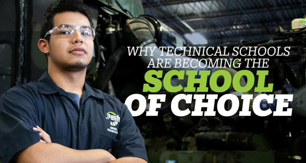 Confident Automotive technology student wearing safety glasses, stands, arms crossed, with the auto shop in the background