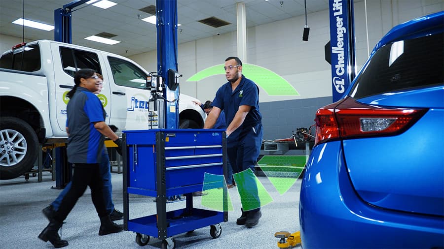 J-Tech students working in the Automotive Technology lab with their 300+ tool sets.