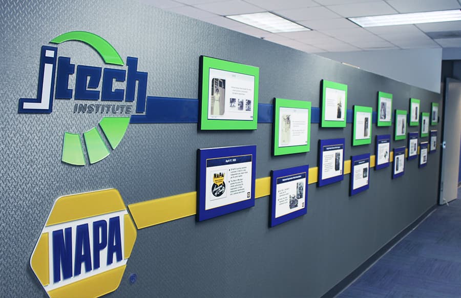 Photo of the timeline wall at J-Tech, featuring landmark events for both J-Tech Institute and NAPA® Auto Parts.