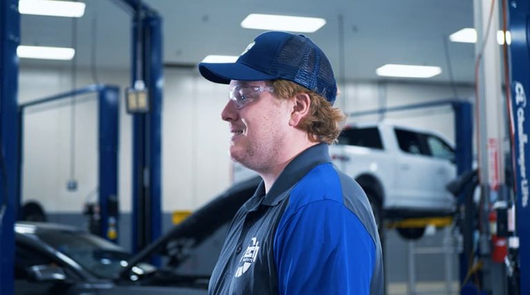 A J-Tech Automotive Technology student working hands-on in the lab.