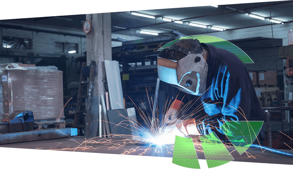 A welder in an industrial shop