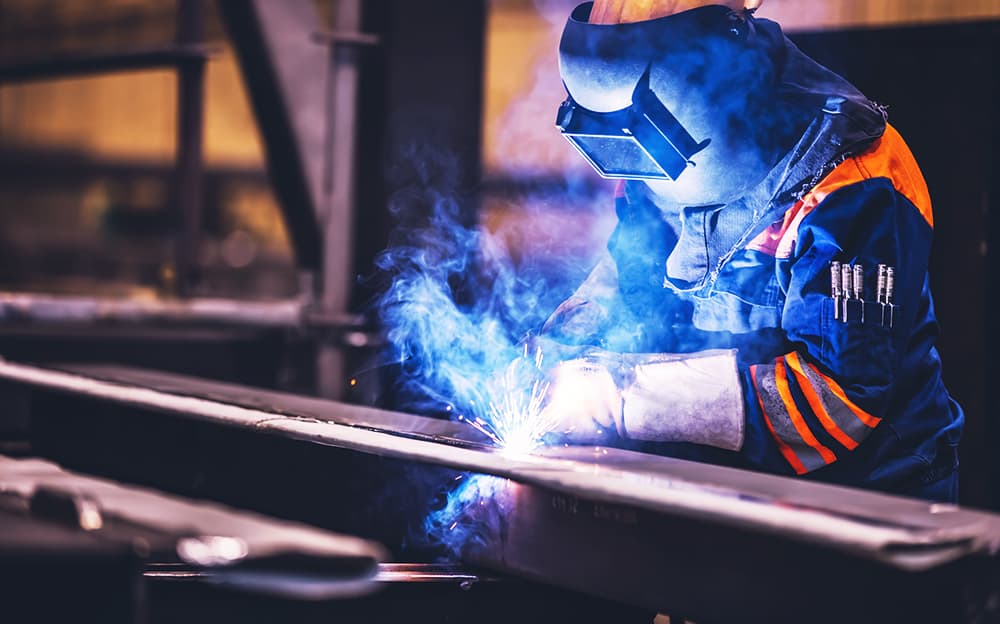 Welder working in a factory