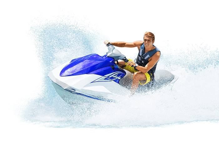 A young man riding a jet ski