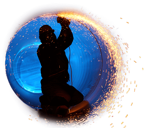 Pipe welder inside a giant pipe, joining a seam.