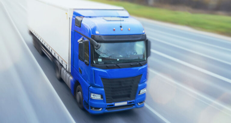 A Semi-Truck Driving on the Highway.