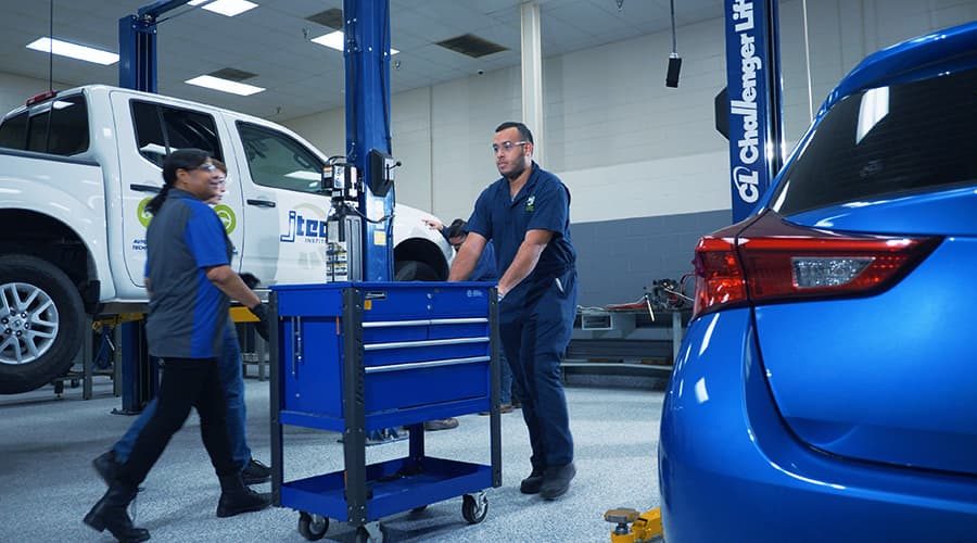 J-Tech students working with their 300+ piece tool sets in the Automotive Technology lab.