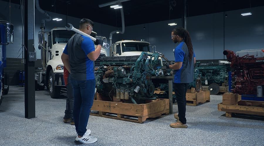 J-Tech students working on a truck engine in the Diesel Technology lab.